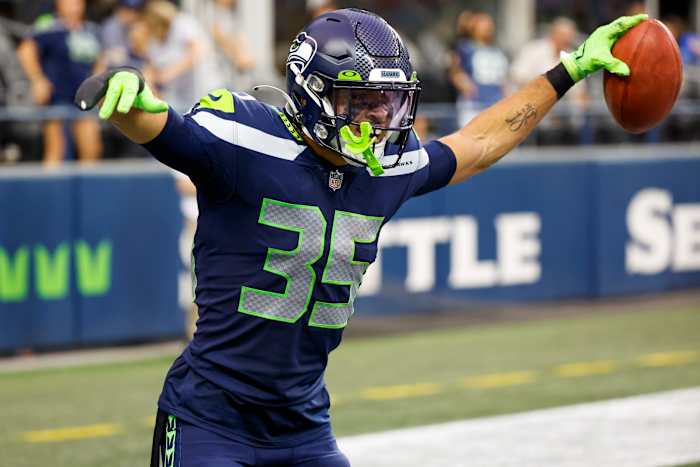 Seattle Seahawks safety Joey Blount (35) celebrates after recovering an on-side kick against the Chicago Bears during the fourth quarter at Lumen Field.